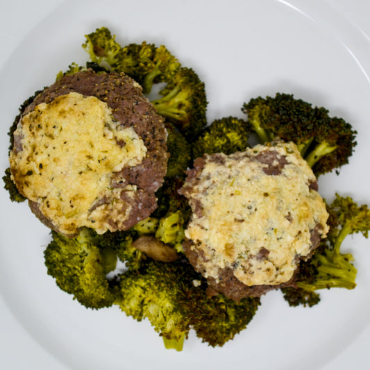Parmesan Crusted Chop Steak Served With Roasted Broccoli, Red Onions & Mushrooms