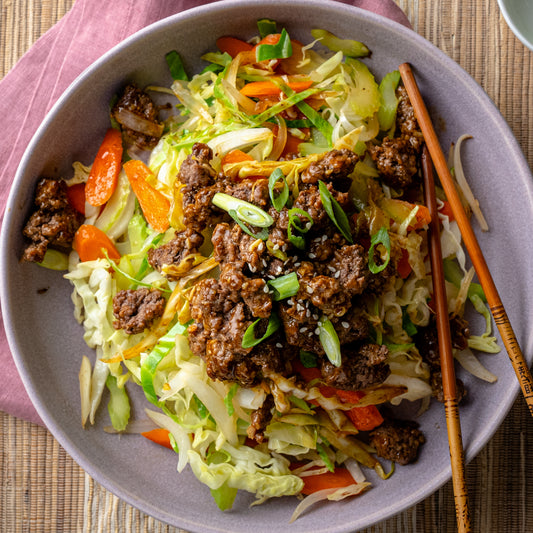 Spicy Beef Stir Fry Over Wok Fried Cabbage